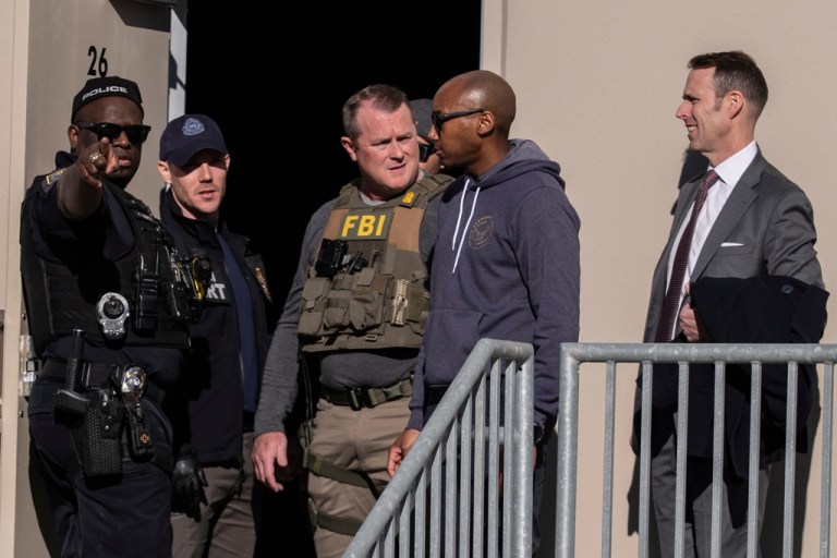 FBI agents are seen at the Fulton County Election Hub and Operation Center.