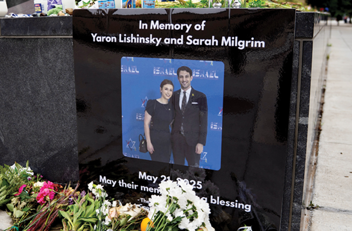 A memorial to Yaron Lischinsky, 30, and Sarah Lynn Milgrim, 26, near the Capitol Jewish Museum in Washington, D.C., where they were murdered, May 29, 2025. (Allison Robbert/Washington Post/Getty)