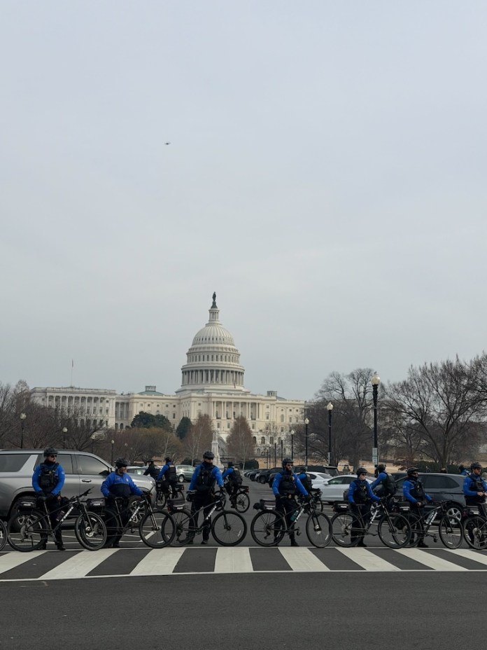 Capitol&nbsp;police line up outside of the U.S Capitol building as January 6 defendants and families peacefully approach. (Sydney Topf/Washington Examiner)