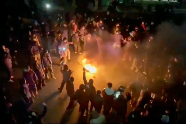 3 of 3 | This frame grab from footage circulating on social media shows protesters dancing and cheering around a bonfire as they take to the streets despite an intensifying crackdown as the Islamic Republic remains cut off from the rest of the world, in Tehran, Iran, Jan. 9, 2026. (UGC via AP, File)