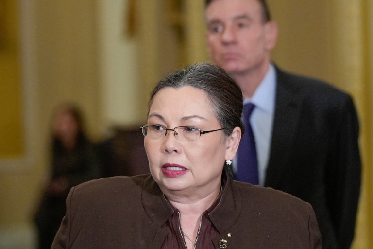 Sen. Tammy Duckworth, D-Ill., left, speaks as Sen. Mark Warner, D-Va., right, listens during a news conference after a policy luncheon on Capitol Hill, Tuesday, Jan. 6, 2026, in Washington.