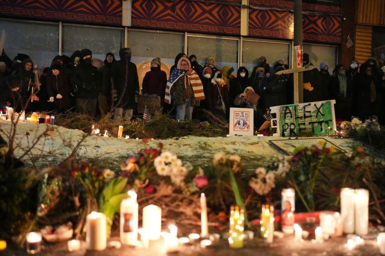 People gather during a vigil for 37-year-old Alex Pretti, who was fatally shot by a U.S. Border Patrol agent.