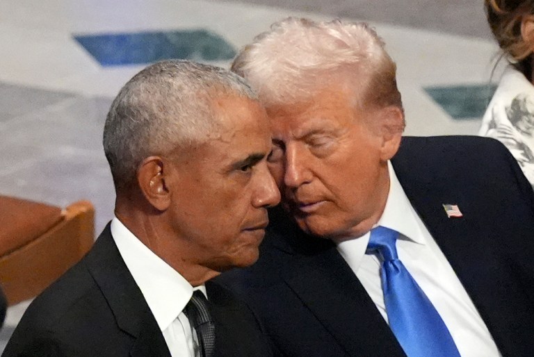 Former President Barack Obama talks with then-President-elect Donald Trump.