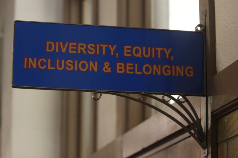 The sign above the door to the Office of Diversity, Equity, Inclusion and Belonging inside the main administration building on the main University of Kansas.