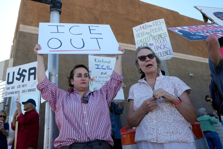 People gather during a protest against immigration enforcement operations.