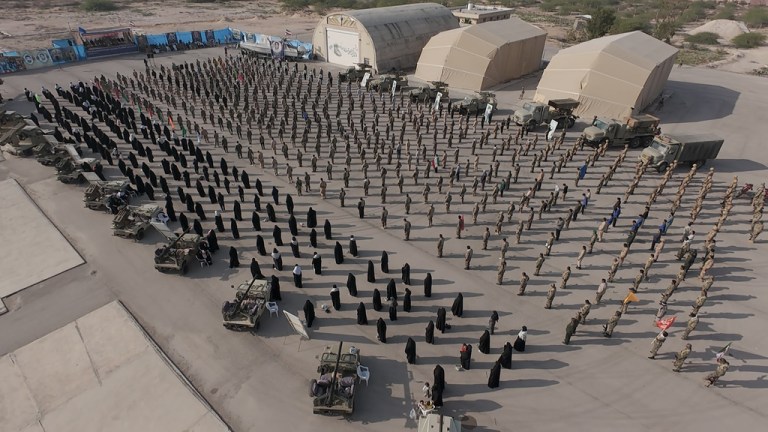 Iranian soldiers stand at attention in Persian Gulf