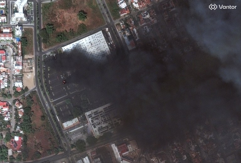 Smoke rises from cars on fire at a Costco parking lot in Puerto Vallarta, Mexico, Sunday, Feb. 22, 2026, as violence breaks out after the Mexican army killed the leader of the Jalisco New Generation Cartel, Nemesio Rubén Oseguera Cervantes, known as 