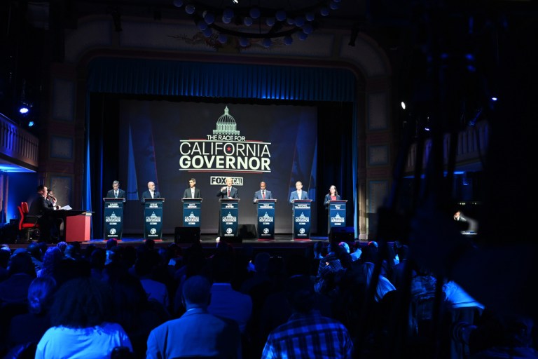Xavier Becerra, Steve Hilton, Matt Mahan, Tom Steyer, Tony Thurmond, Antonio Villaraigosa and Betty Yee stand on the stage during the California gubernatorial candidate debate.