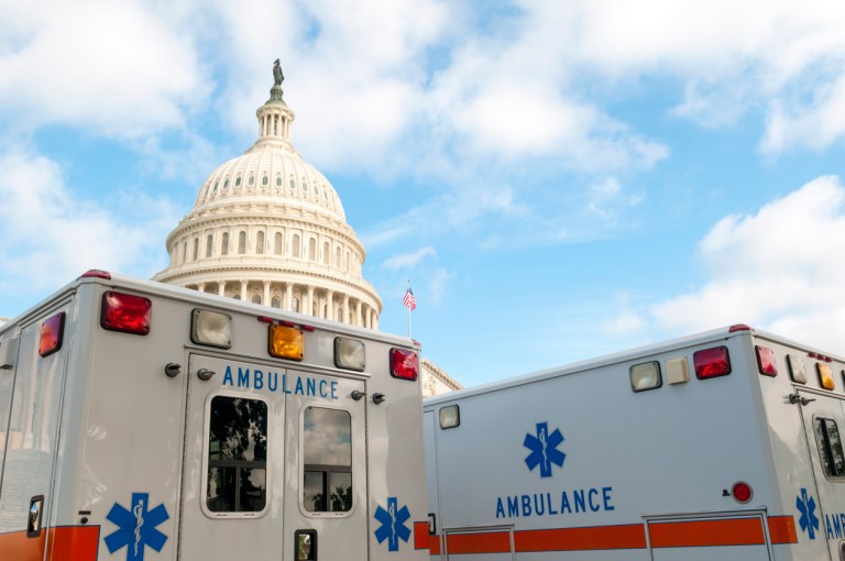 drug costs prescriptions healthcare and stethoscope on US dollar bills healthcare spending costs
