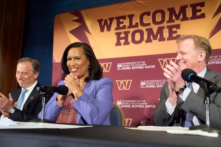 Washington Commanders controlling owner Josh Harris, from left, District of Columbia Mayor Muriel Bowser and NFL Commissioner Roger Goodell announce a new home for the NFL football team