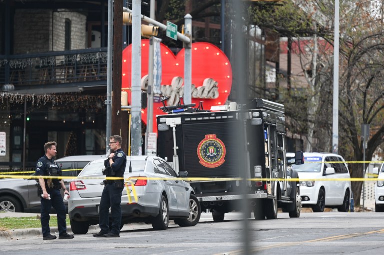 The Austin Police Department and the FBI investigate a shooting at Buford's on 6th Street