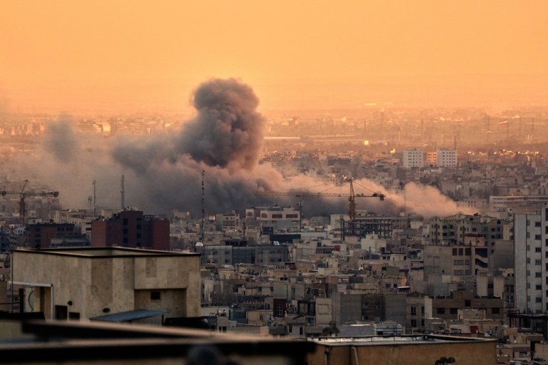A plume of smoke rises following a U.S.-Israeli military strike in Tehran, Iran, Tuesday, March 3, 2026. (AP Photo/Vahid Salemi)