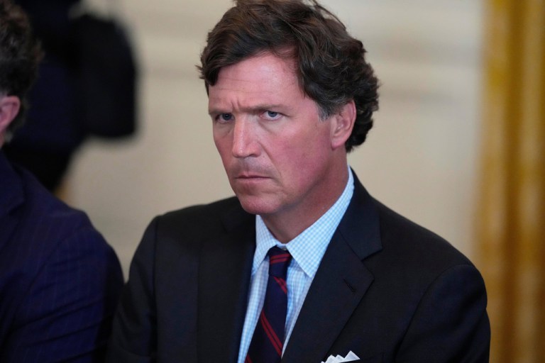 Tucker Carlson attends a meeting with President Donald Trump and oil executives in the East Room of the White House, Friday, Jan. 9, 2026, in Washington. (AP Photo/Alex Brandon)