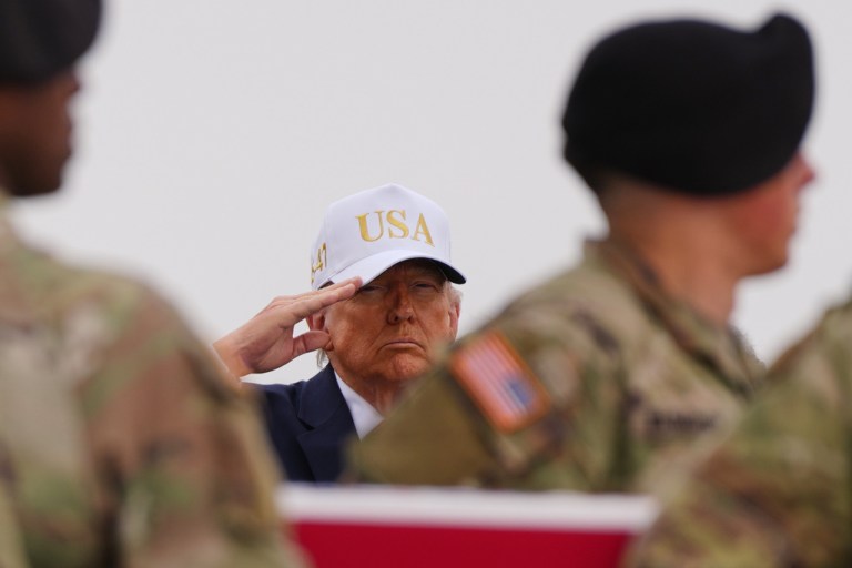 President Donald Trump salutes as an Army carry team moves the flag-draped transfer case containing the remains of U.S. Army Reserve Chief Warrant Officer 3 Robert Marzan, 54, of Sacramento, Calif., who was killed in a drone strike at a command center in Kuwait after the U.S. and Israel launched its military campaign against Iran, during a casualty return Saturday, March 7, 2026, at Dover Air Force Base, Del.