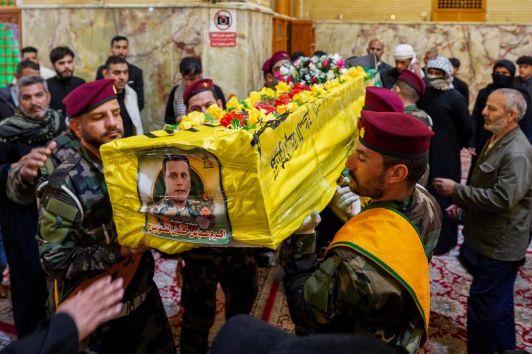 Hezbollah attend the funeral of colleagues who were killed in a U.S. airstrike in Qaim province