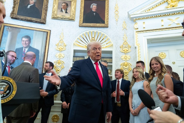 President Donald Trump speaks with reporters during the swearing in ceremony for Homeland Security Secretary Markwayne Mullin in the Oval Office of the White House, Tuesday, March 24, 2026, in Washington. (AP Photo/Alex Brandon)