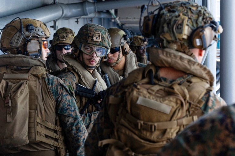 U.S. Sailors and Marines aboard USS Tripoli