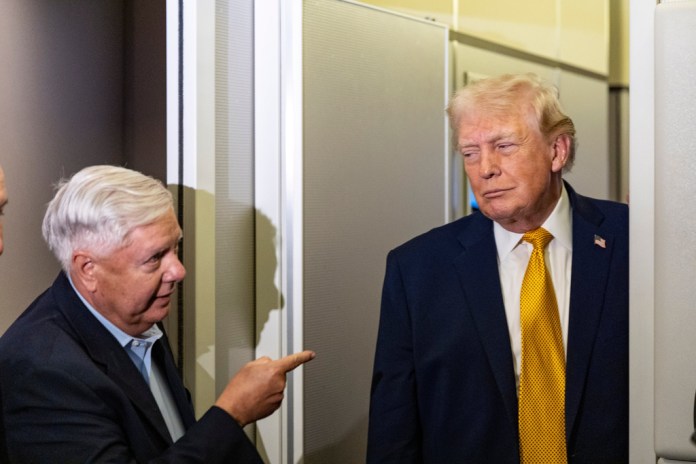 President Donald Trump, accompanied by Sen. Lindsey Graham, R-S.C., speaks with reporters while in flight on Air Force One, Sunday, Jan. 4, 2026