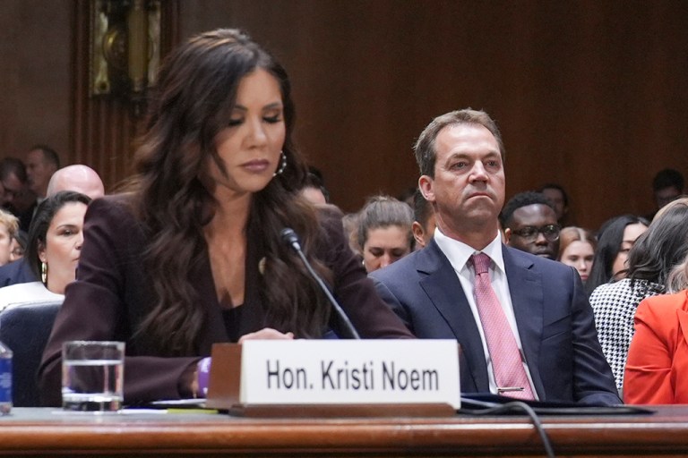Then-Homeland Security Secretary Kristi Noem and her husband, Bryon Noem, appear for a March 2026 Senate Judiciary Committee hearing.