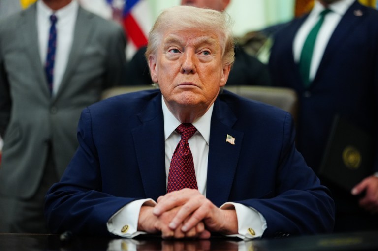 President Donald Trump listens in the Oval Office of the White House, Saturday, April 18, 2026, in Washington.