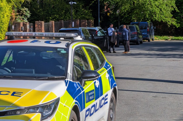 A police car is parked outside Kenton United Synagogue