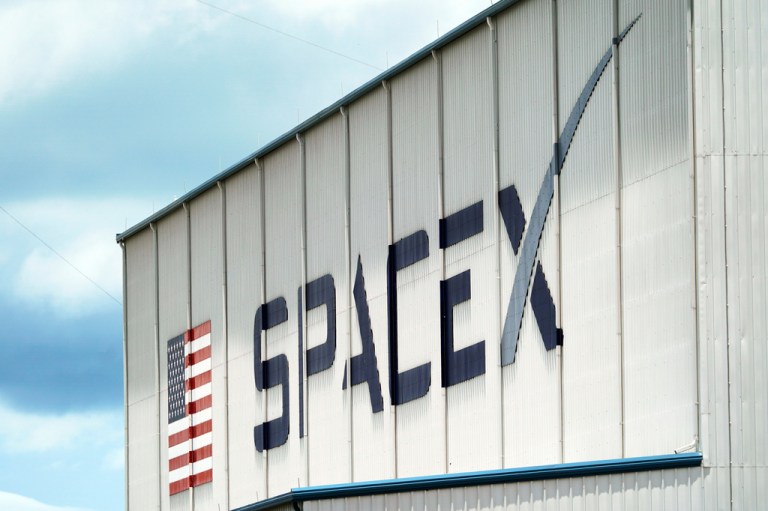 A SpaceX logo on a building.