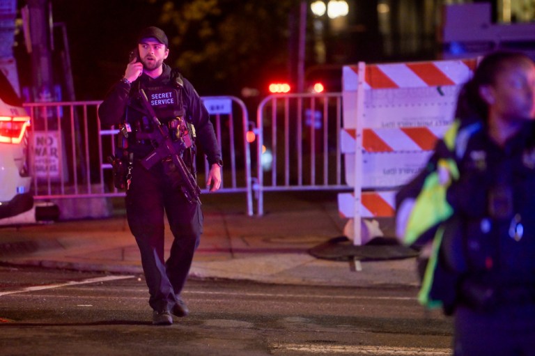 Members of the U.S. Secret Service and local police work to contain the scene outside the White House Correspondents' Dinner, during a shooting inside the Washington Hilton, Saturday, April 25, 2026, in Washington. (AP Photo/Rod Lamkey, Jr.)