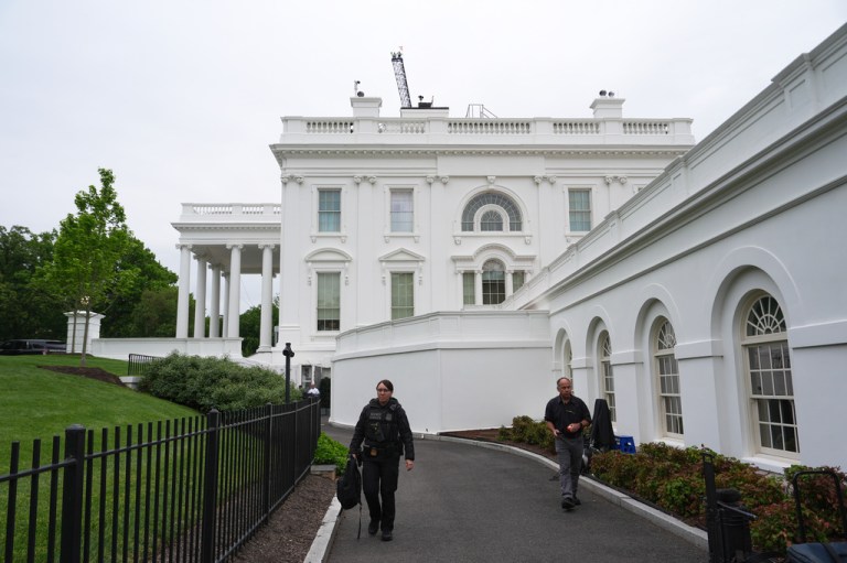 A Secret Service agent walks near the White House, Tuesday, April 28, 2026, in Washington. (AP Photo/Julia Demaree Nikhinson)