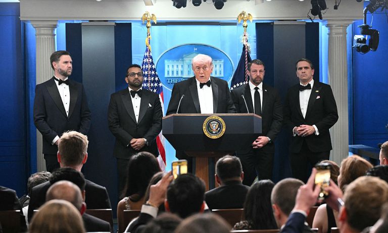 US President Donald Trump speaks, flanked by US Vice President JD Vance and FBI Director Kash Patel, during a press briefing in the Brady Briefing Room at the White House in Washington, D.C., shortly after shots were fired at the White House Correspondents' Association dinner on April 25, 2026. (Photo by Mandel NGAN / AFP via Getty Images)