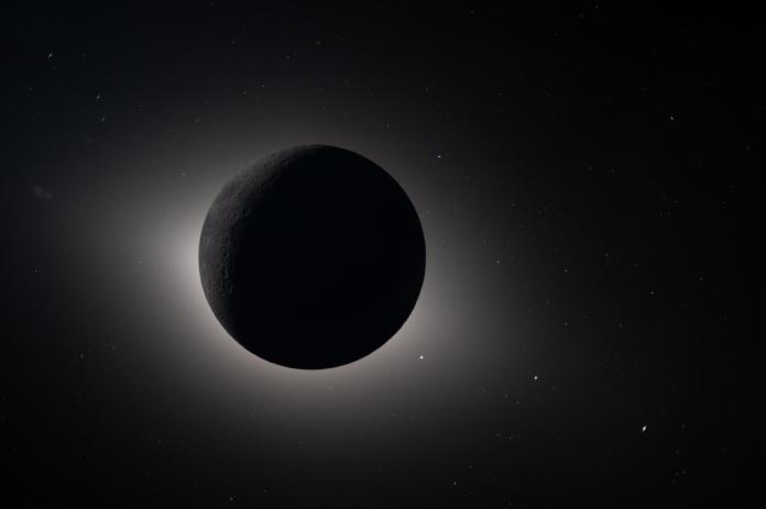 The moon fully eclipsing the sun.