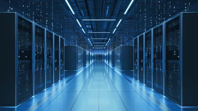 Interior view of a futuristic data center designed for artificial intelligence processing, featuring glowing servers and digital data streams.