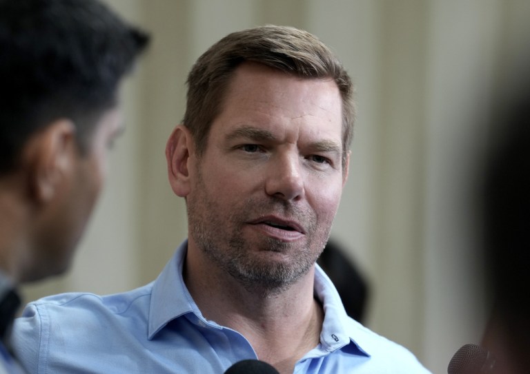 California gubernatorial candidate Rep. Eric Swalwell (D-CA) talks with reporters after holding a town hall meeting in Sacramento on April 7, 2026.