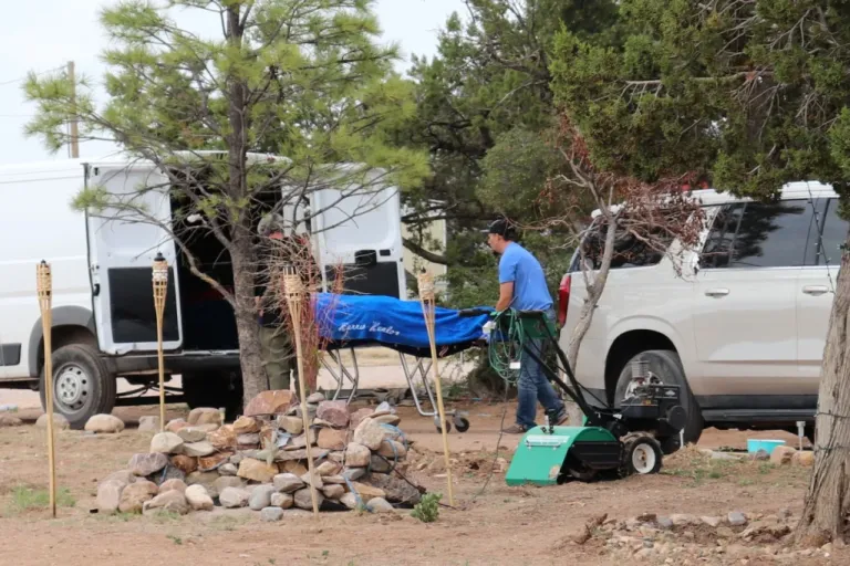 2 of 5 | Workers remove a body in Mountainair, N.M., Wednesday, May 20, 2026, after several people died and more than a dozen first responders were exposed to an unknown substance. (AP Photo/Savannah Peters)