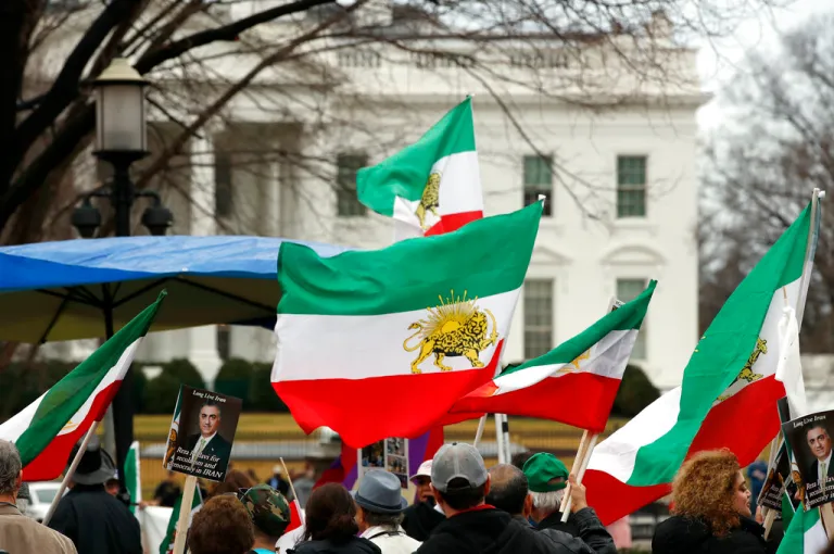 Sun and Lion flags are seen at a rally in support of the recent liberation movement in Iran, in Lafayette Square in front of the White House, Sunday, Feb. 11, 2018, in Washington.
