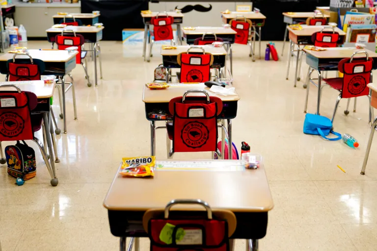 Desks are arranged in a classroom