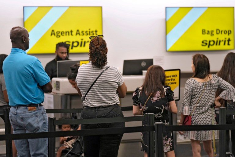 Passengers wait in a line for help at the Spirit Airlines ticket counter at the Tampa International Airport Thursday, June 1, 2023, in Tampa, Fla. Spirit Airlines and Air Canada have delays due to technical problems. (AP Photo/Chris O'Meara)
