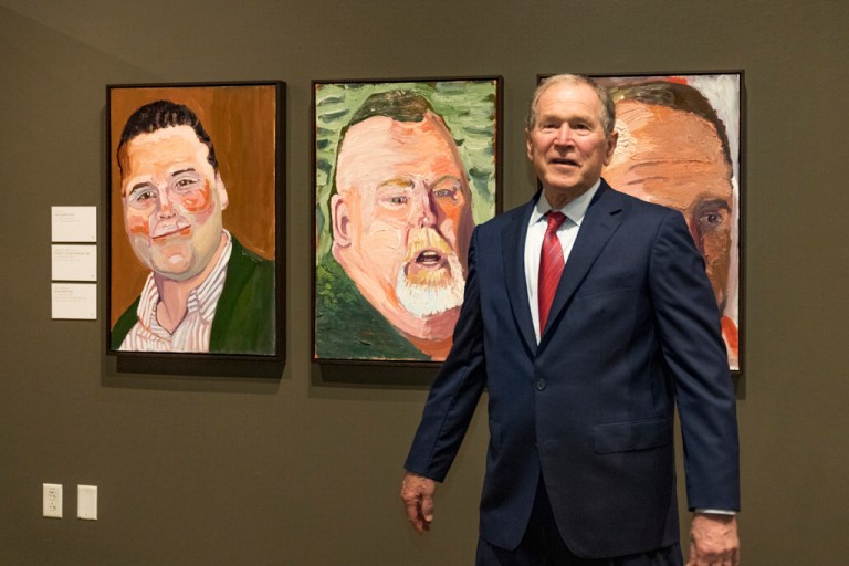 Former President George W. Bush tours an exhibit of his paintings of military veterans.