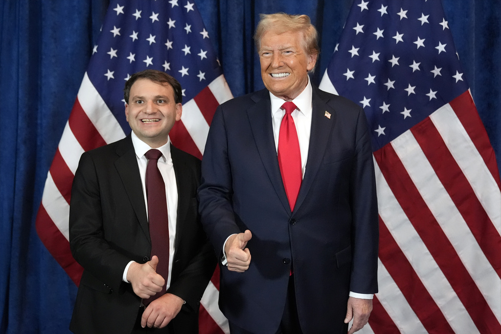 Republican presidential nominee Donald Trump poses for a photo with Wyoming Secretary of State candidate Chuck Gray