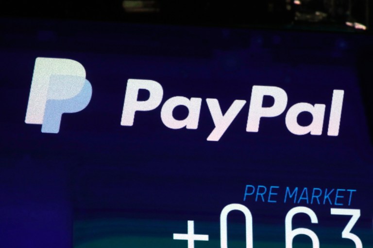 The PayPal logo appears on a screen at the Nasdaq MarketSite, on Oct. 3, 2018.
