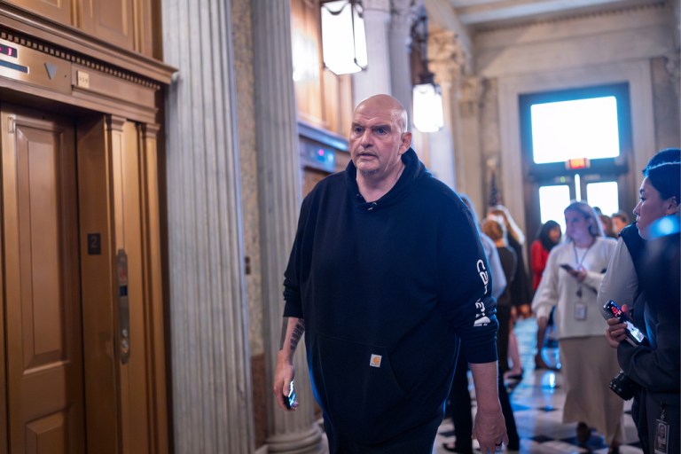Sen. John Fetterman, D-Pa., arrives as senators prepare for a vote on an Iran war resolution sponsored by Sen. Tim Kaine, D-Va., at the Capitol in Washington, Wednesday, March 4, 2026. (AP Photo/J. Scott Applewhite)