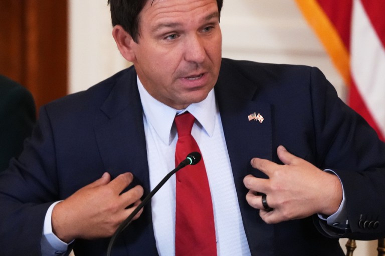 Florida Gov. Ron DeSantis speaks during a roundtable discussion on college sports in the East Room of the White House, Friday, March 6, 2026, in Washington.