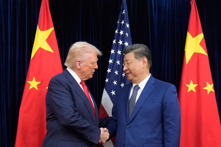 President Donald Trump and Chinese President Xi Jinping shake hands.