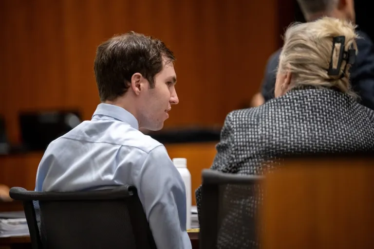 Tyler Robinson, left, speaks with his attorney Kathryn Nester in 4th District Court in Provo, Utah, on Friday, April 17, 2026.