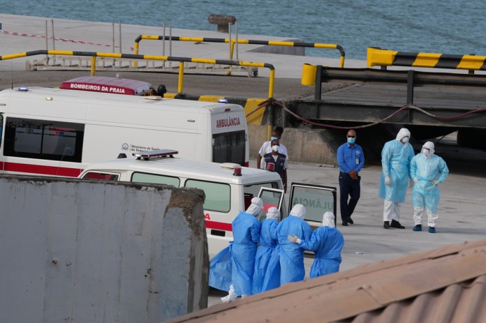 Health workers in protective gear evacuate patients from the MV Hondius cruise ship