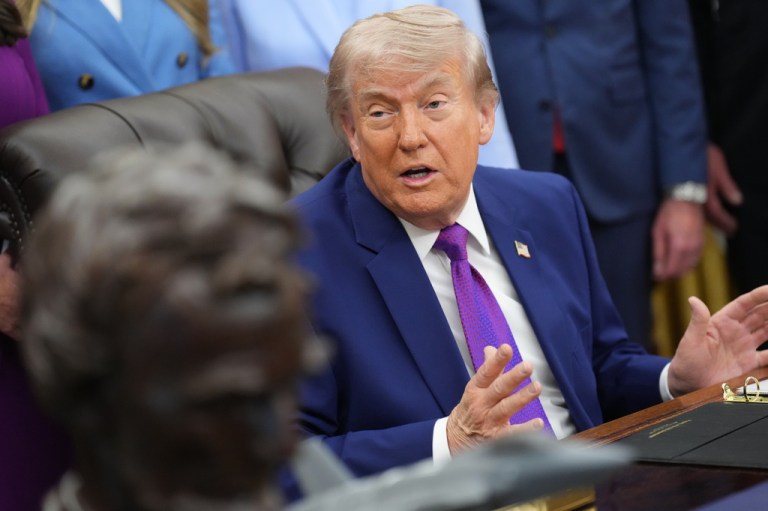 President Donald Trump speaks to reporters.