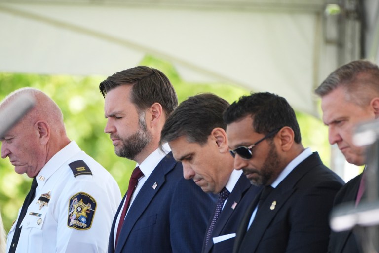 Vice President JD Vance, second from left, Acting Attorney General Todd Blanche, center, and FBI director Kash Patel, center right, bow their heads in prayer.