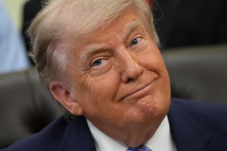 President Donald Trump attends an event about loosening a federal refrigerant rule