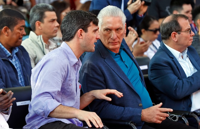 Cuban President Miguel Diaz-Canel, right center, and David Adler, general coordinator of the 