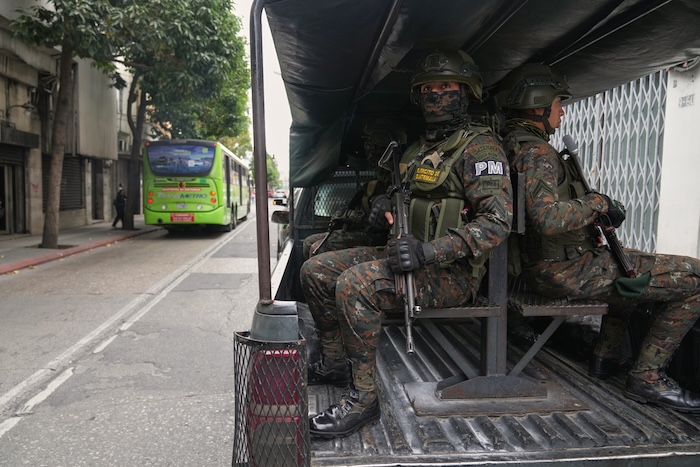 Deployed soldiers stand guard in a vehicle around Congress in Guatemala City, Monday, Jan. 19, 2026, after President Bernardo Arévalo declared a state of emergency. (AP Photo/Moises Castillo)