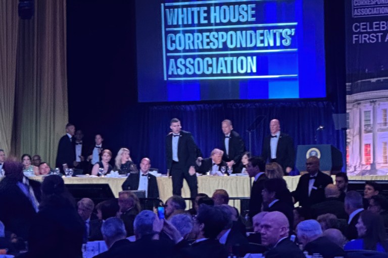 U.S. Secret Service agents surround President Donald Trump after a shooting incident outside the ballroom during the White House Correspondents' Association dinner on April 25, 2026.